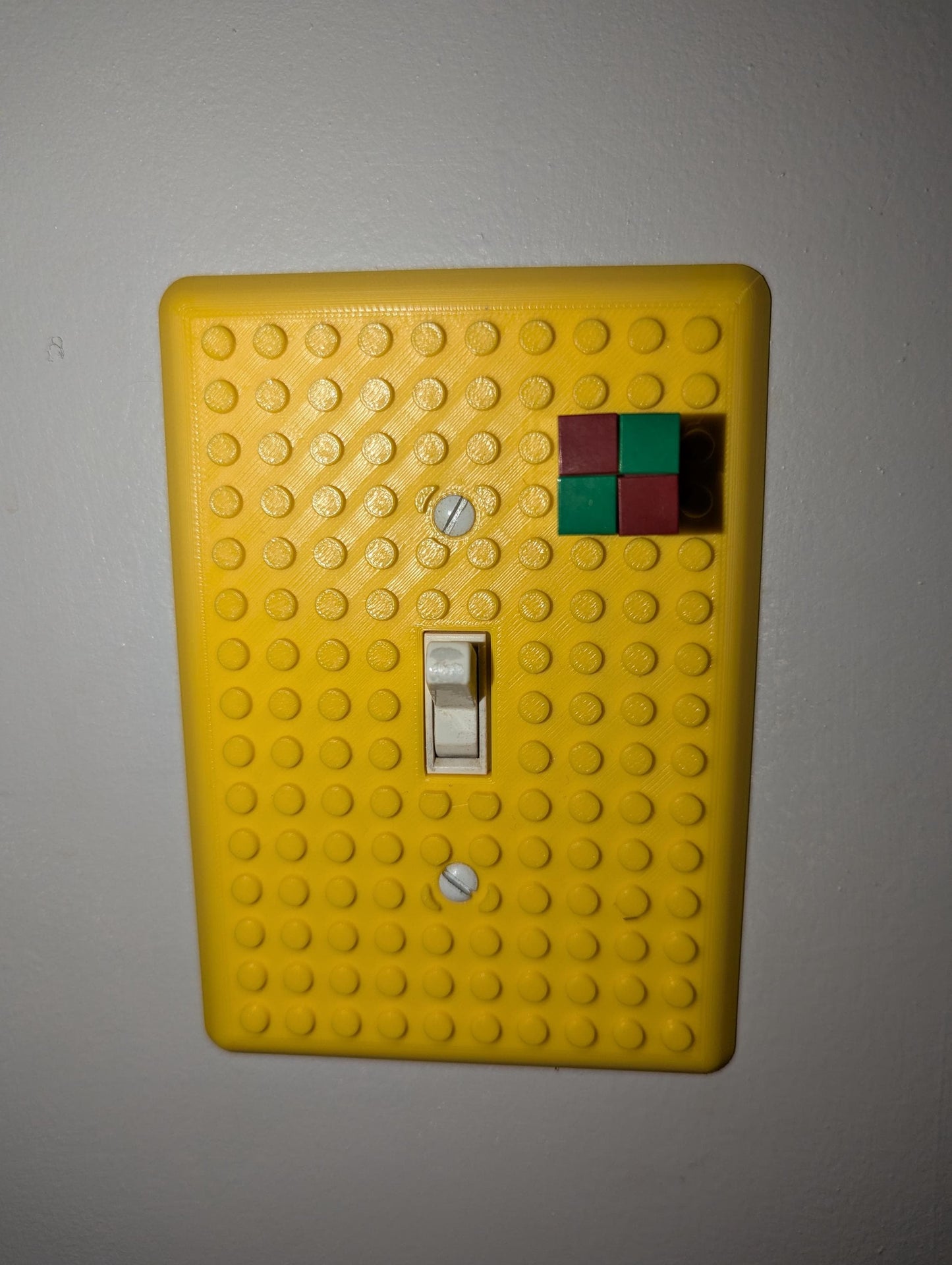 Yellow Building Brick Light switch cover legos attached. Front Profil single light switch
