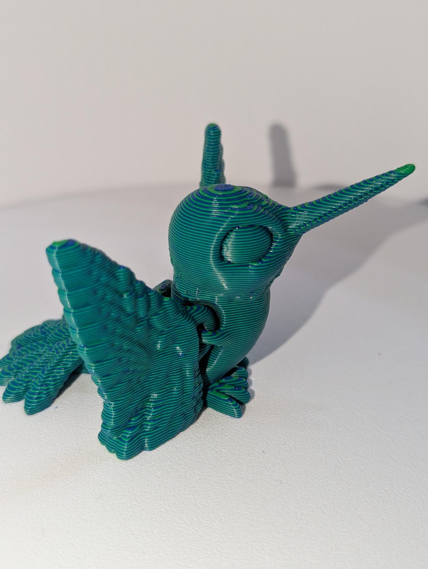 Side profile of striped humming bird. super cute for spring