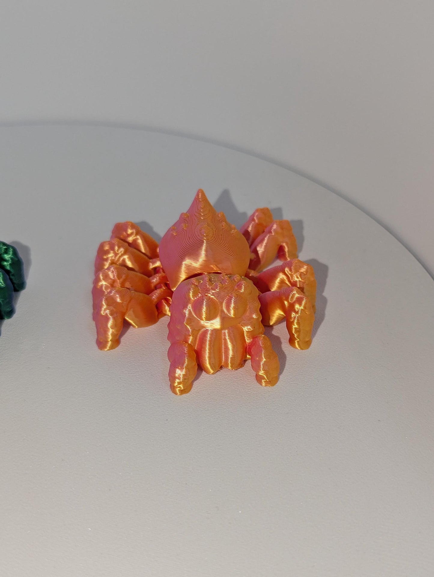 Up-close view of the orange articulated spider