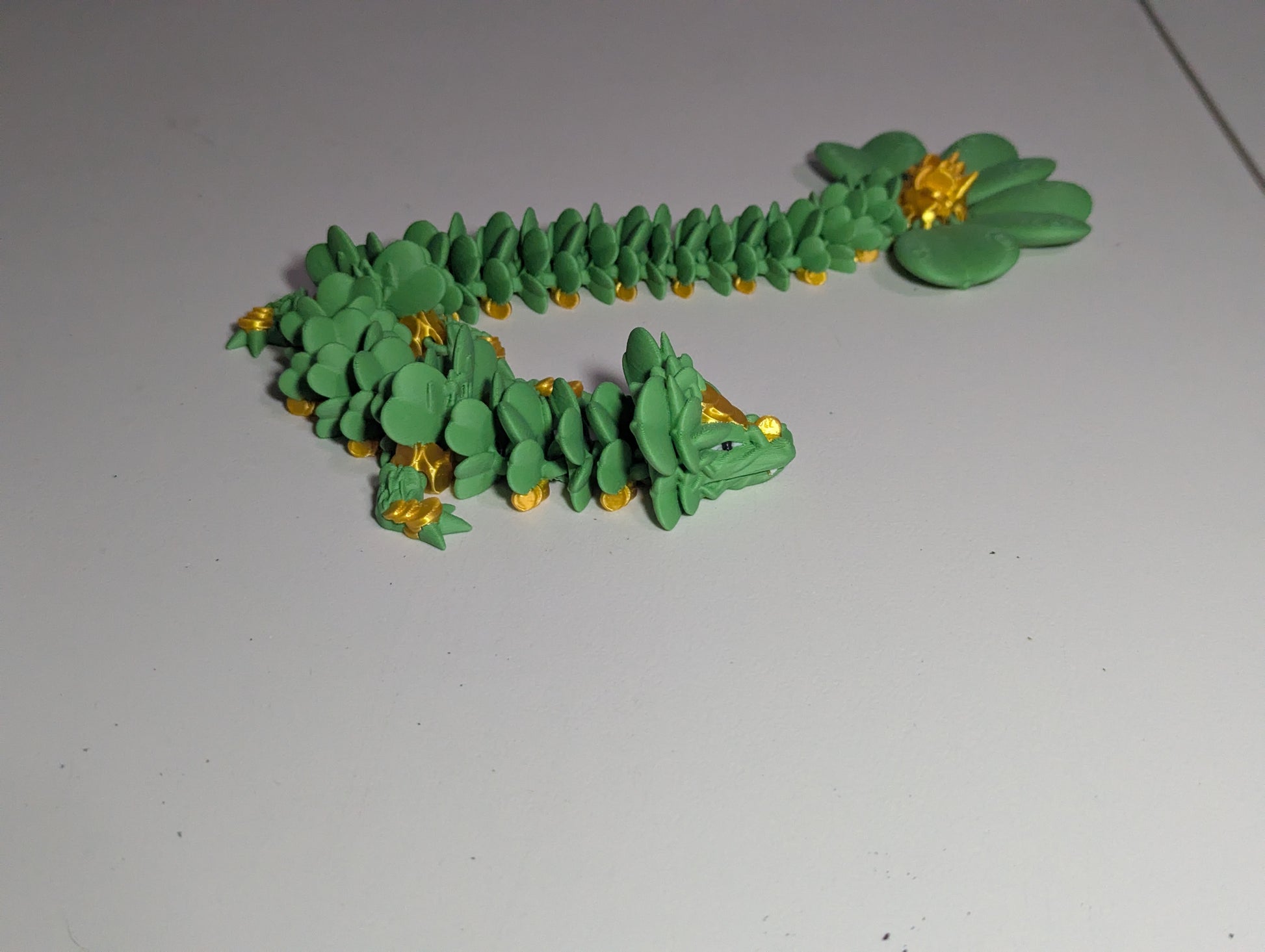 Lucky Clover Articulating Baby Dragon Initiative Design