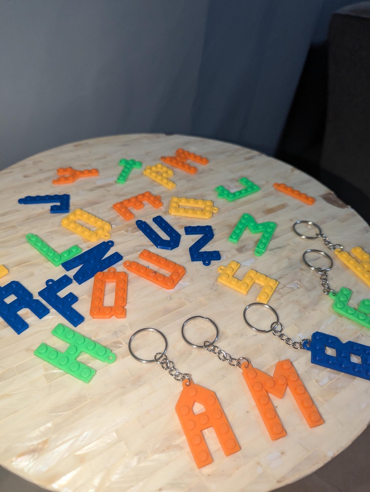 Letter Lego key chains in different colors.