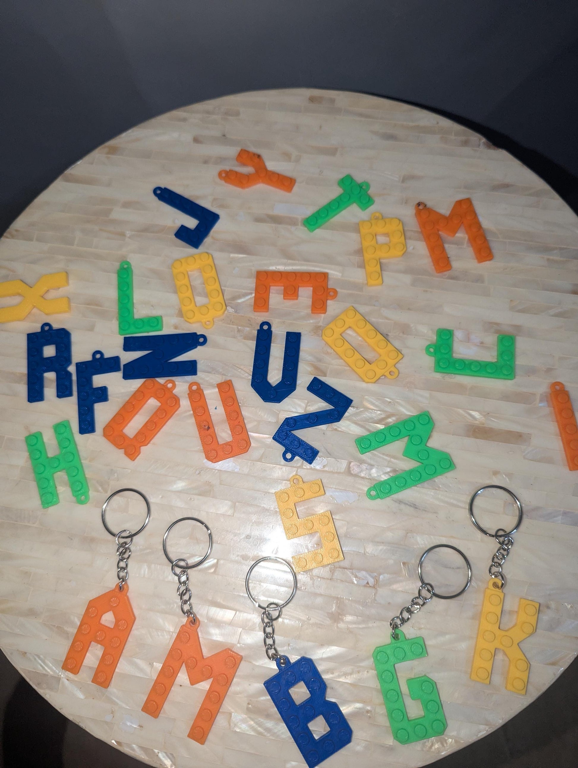 Letter Lego key chains in different colors.