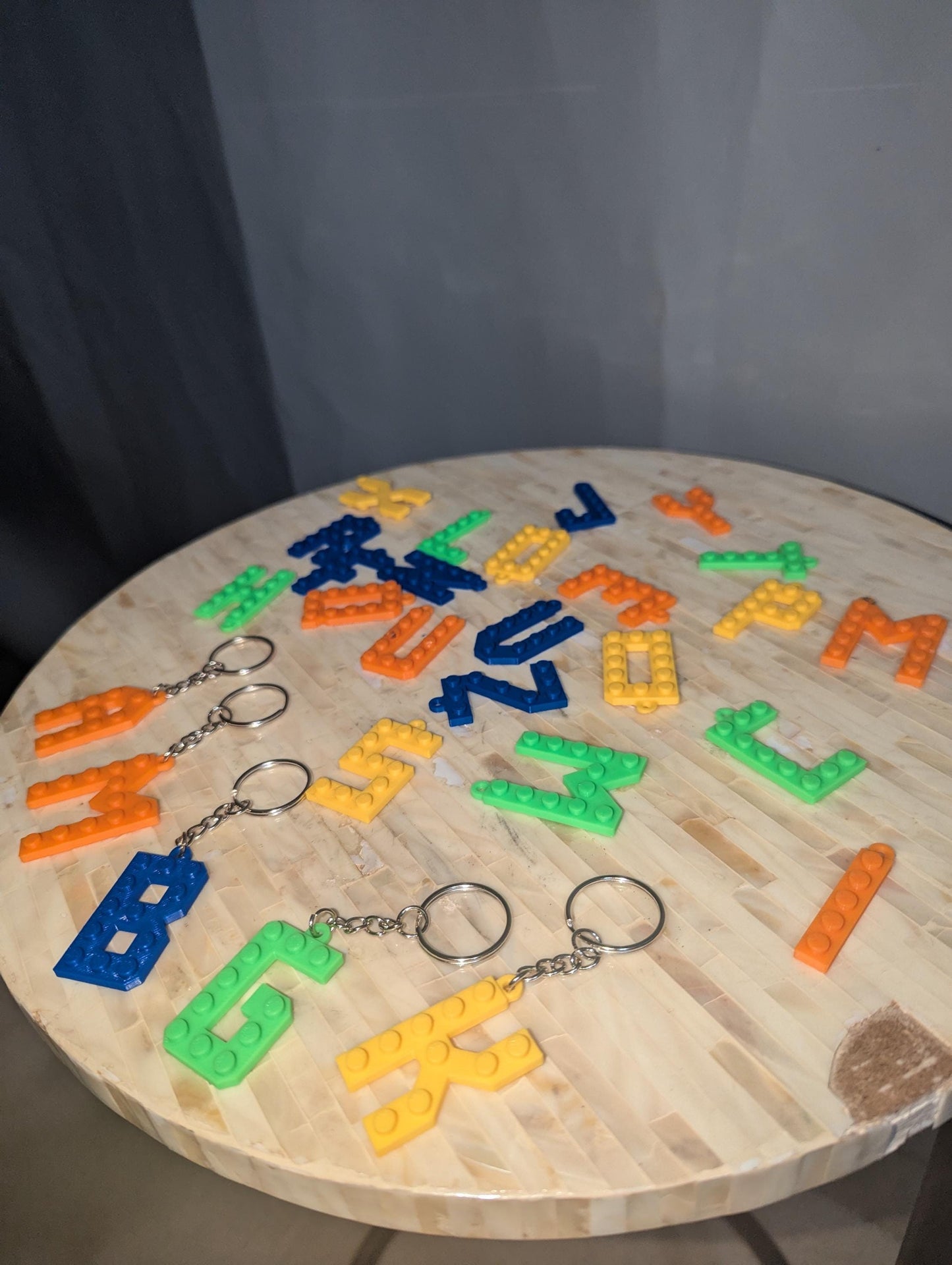 Letter Lego key chains in different colors.