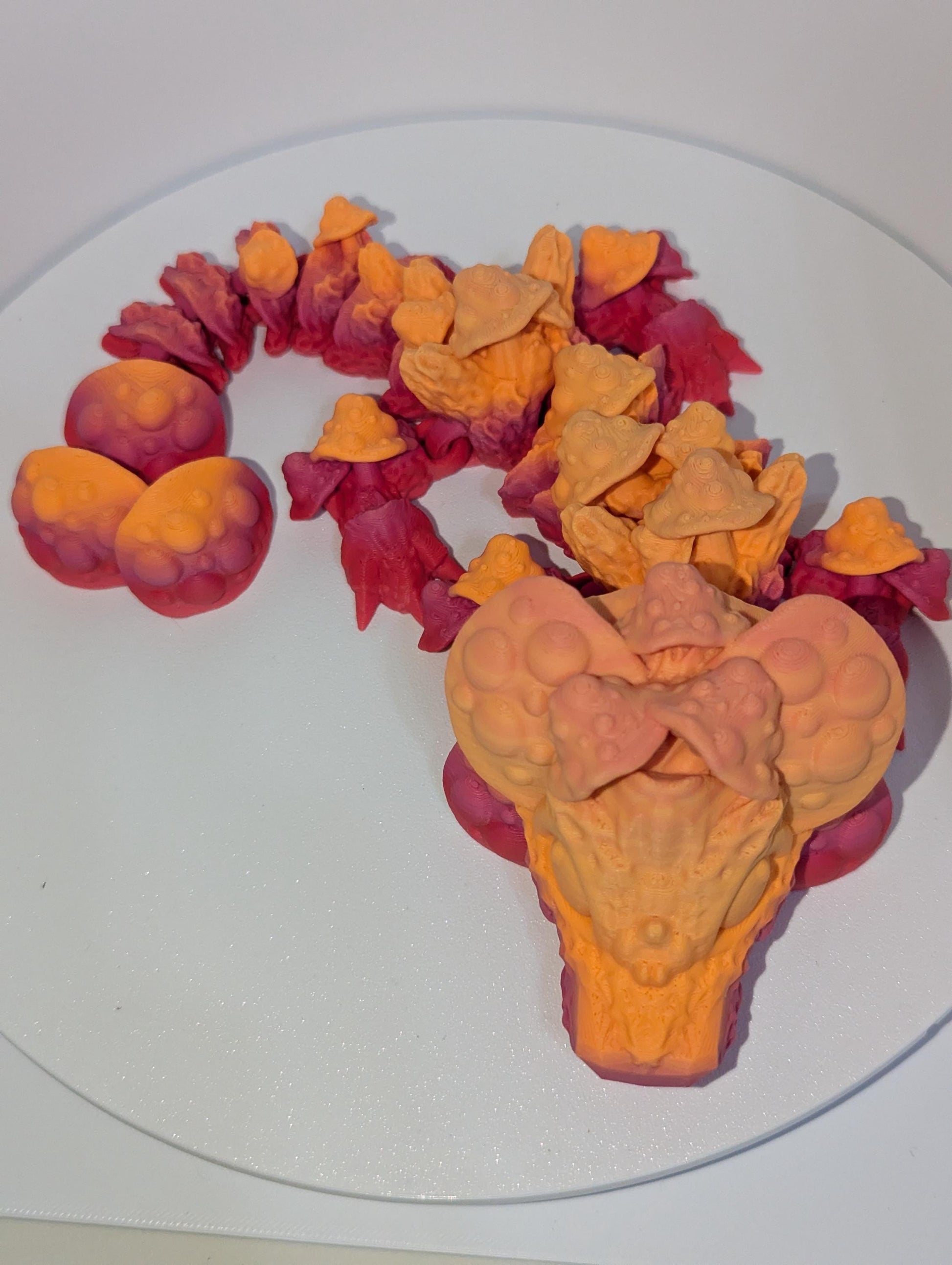 Front profile of this adorable articulated mushroom dragon.